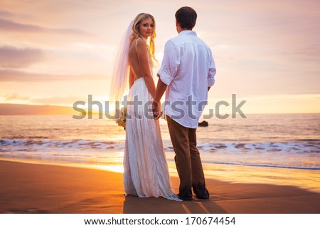 Married Couple, Bride And Groom At Sunset On Beautiful Tropical Beach In Hawaii