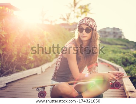 Fashion Lifestyle, Beautiful Young Woman With Skateboard, Backlit At Sunset