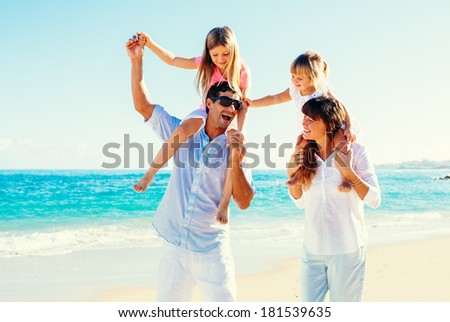 Happy Family Having Fun on Tropical Beach