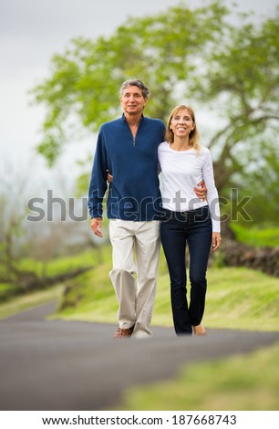 Mature middle age couple in love walking in countryside