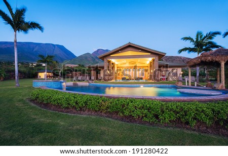 Luxury home with swimming pool at sunset, Tropical Villa Resort