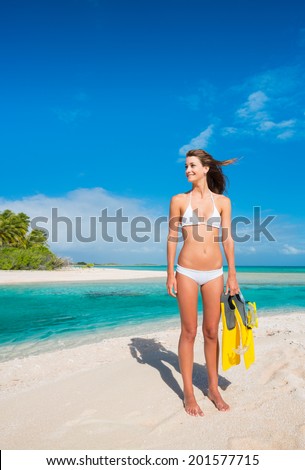 Beautiful Young Woman on Tropical Island with Snorkel Gear