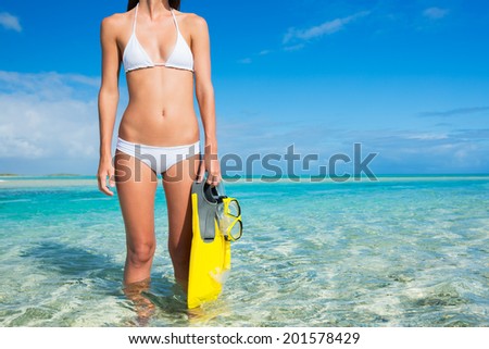 Beautiful Young Woman on Tropical Beach with Snorkel Gear