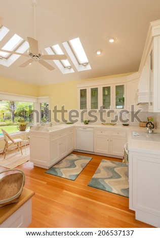 Classic kitchen in beautiful bright home with wood floors