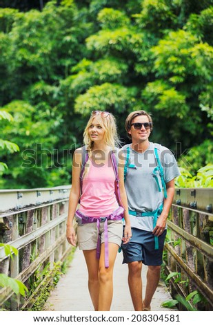 Attractive young couple having fun together outdoors on hike