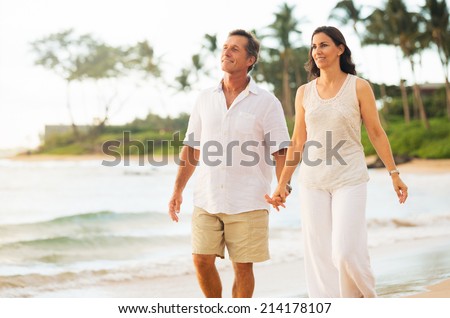 Romantic Mature Couple Enjoying Walk on the Beach