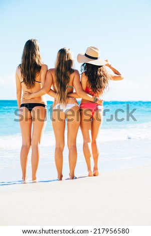 Beautiful Sexy Girls in Bikinis on Tropical Sunny Beach