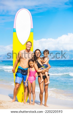 Happy Family with Surfboards on Tropical Beach