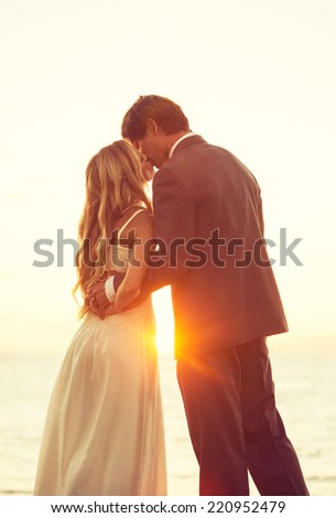 Beautiful Sunset Wedding. Bride and Groom at Sunset