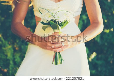 Beautiful Bride with Wedding Bouquet, Close up detail. Soft focus, Shallow depth of field.