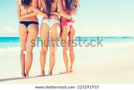 Group of Three Beautiful Hot Young Women on the Beach in Small Sexy Bikinis