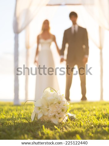 Wedding, Beautiful Bride and Groom Holding Hands. Focus of Bouquet, Shallow Depth of Field