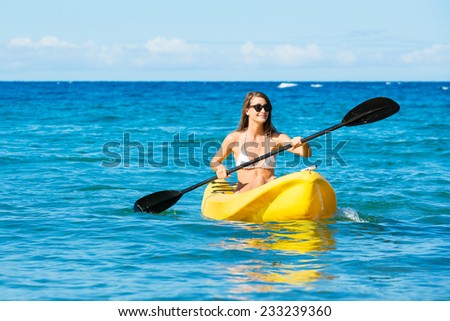 Woman Kayaking in the Ocean on Vacation in Hawaii