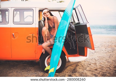 Beach Lifestyle, Beautiful Surfer Girl with Classic Vintage Surf Van on the Beach at Sunset