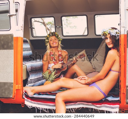 Beach Lifestyle. Beautiful Young Surfer Girls Having Fun Hanging Out in Vintage Surf Van. Best Friends.