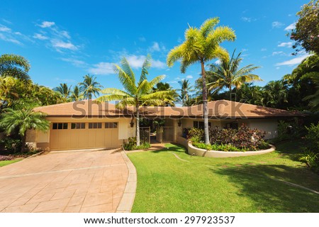 Tropical Luxury Home, Exterior View with Green Lawn and Driveway