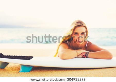 Beautiful Blonde Surfer Girl on the Beach at Sunset