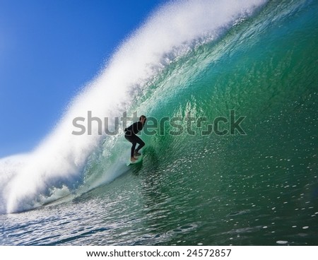 Surfer on a  Big Beautiful Wave in an Epic Tube