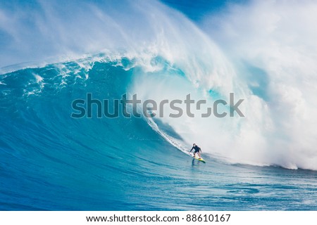 MAUI, HI - MARCH 13: Professional surfer Carlos Burle rides a giant wave at the legendary big wave surf break known as \