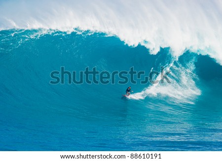 MAUI, HI - MARCH 13: Professional surfer Billy Kemper rides a giant wave at the legendary big wave surf break known as \