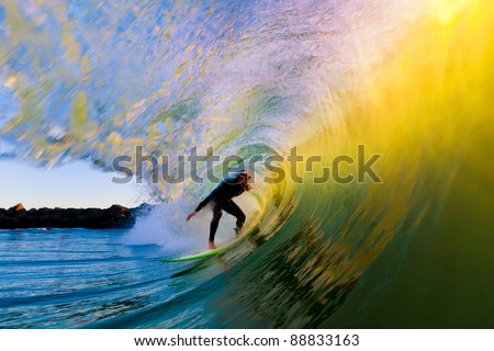 Surfer on Wave at Sunset, Getting Barreled in the Tube