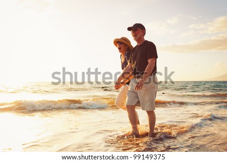 Senior Couple Enjoying Sunset at the Beach