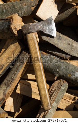 Axe on top of a pile of timber