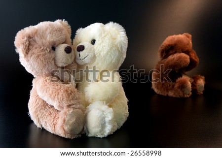 three  romantic teddy bear, isolated on black background