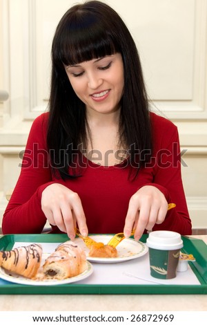 Portrait of young happy smiling woman with cake