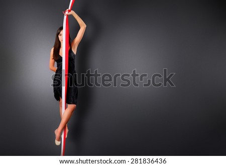 Artistic Gymnastics, sportswoman with ribbon looking for us
