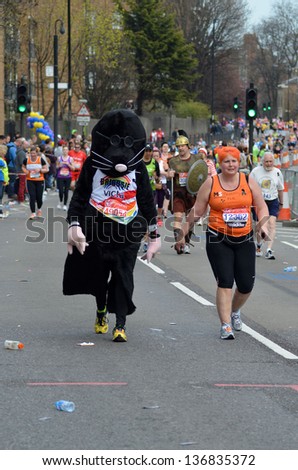 LONDON - APRIL 21: Fun runners take part in the 2013 London Marathon to raise money for charity on the streets of London April 21st, 2013 in London, England.