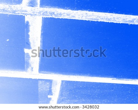 An photographic image of some dirty windows with some rusty window frames.
