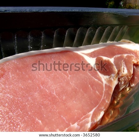 An image of some sliced bacon within its package.