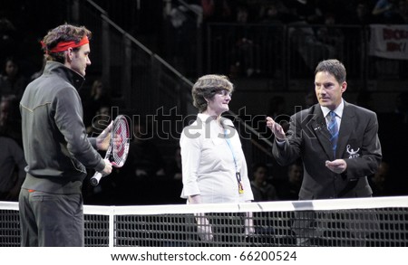 LONDON - NOV 27: Roger Federer And Umpire And Coin Toss Winner At The ATP World Tour November 27, 2010 O2 Building, Central London, England.