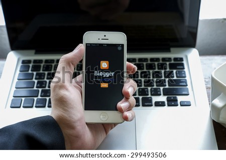 CHIANGMAI,THAILAND - JULY 24, 2015: Photo of new Apple iPhone5smartphone device  open Blogger application .Blogger is a free weblog publishing tool from Google, for sharing text, photo and video.