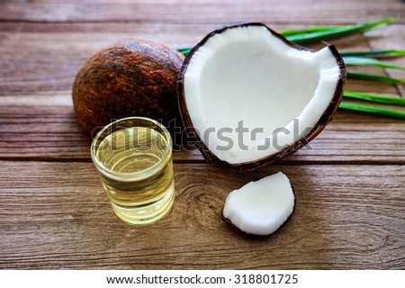 Coconut and coconut oil for alternative therapy on the wood table