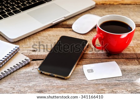CHIANG MAI,THAILAND - NOV 19,2015 smart phone, notebook and, Cassette tape, cup of coffee. on the wood table