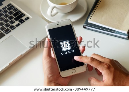 CHIANG MAI,THAILAND - MAR 12 2016 : iPhone 6s Plus Uber app showing on Samsung in the car,Uber is smartphone app-based transportation network.
