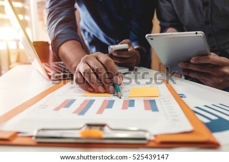 Business team meeting present.professional investor working with new startup project. Finance managers task.Digital tablet laptop computer design smart phone in morning light