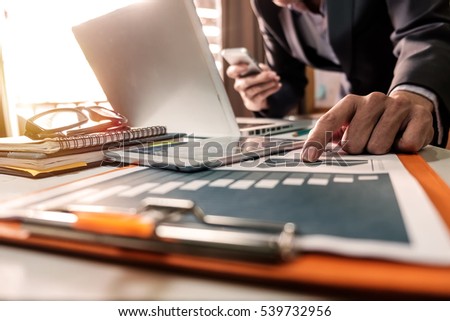 Businessman making presentation with his colleagues and business strategy digital layer effect at the office as concept in morning light