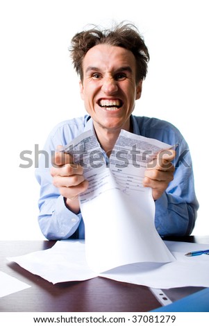 smiling businessman ripping the contract on white