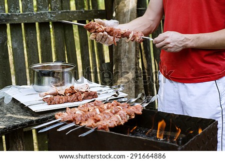 meat skewers, pork, chicken, beef, hands