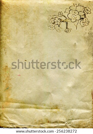 Sheet of old paper with a sketch of branches of fruit flowers in the corner