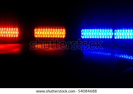 Photo of red and blue LED police roof lights on a police cruiser