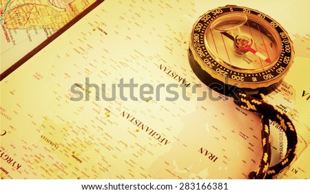 Travel, compass and a map of the Middle East