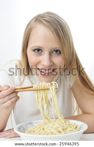 stock photo : Blond woman use chopsticks eating noodles