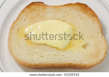 single piece of toast with butter