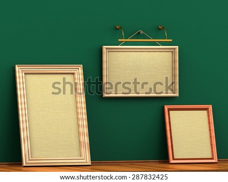 Three empty wooden picture frame from a rope hanging lamp illuminates concrete wall wooden floor