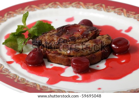 meat in a sweet sauce on a plate. isolated on a white background