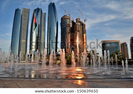 The fountain on the background of skyscrapers in Abu Dhabi United Arab Emirates The fountain on the background of skyscrapers in Abu Dhabi United Arab Emirates